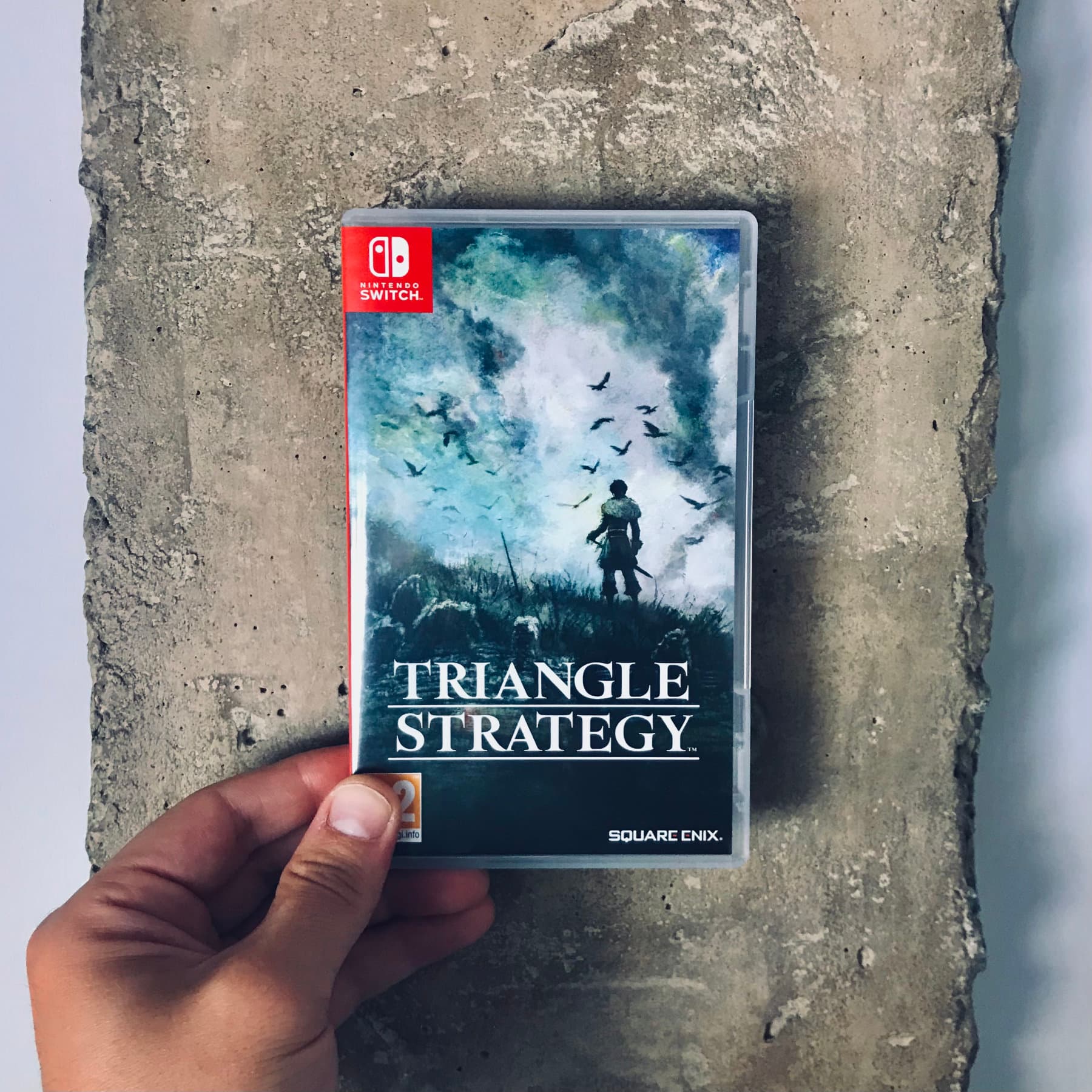 Portada del videojuego: Triangle Strategy Portada del videojuego: Triangle Strategy